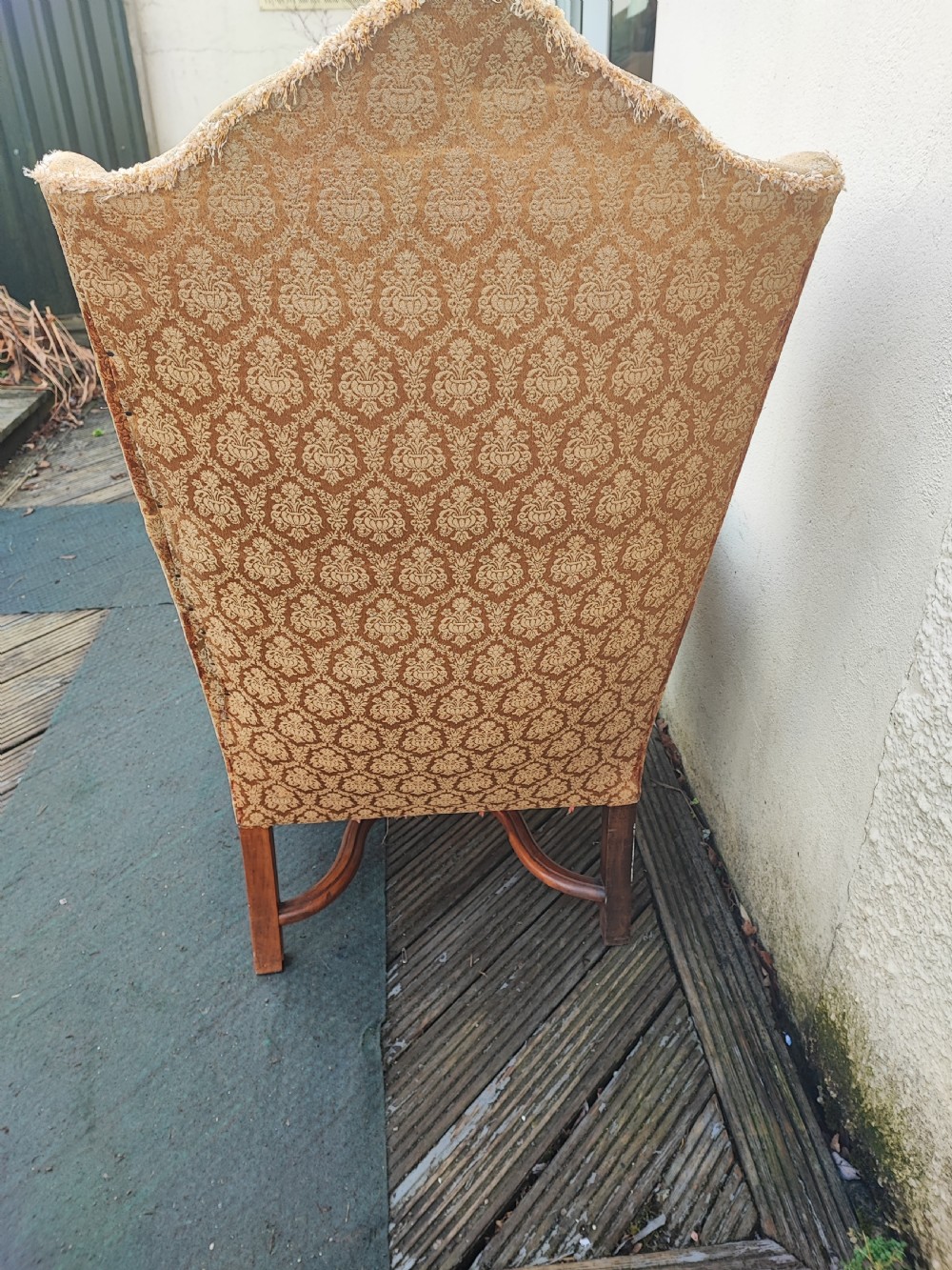 Substantial antique walnut wing chair,for reupholstery. View II