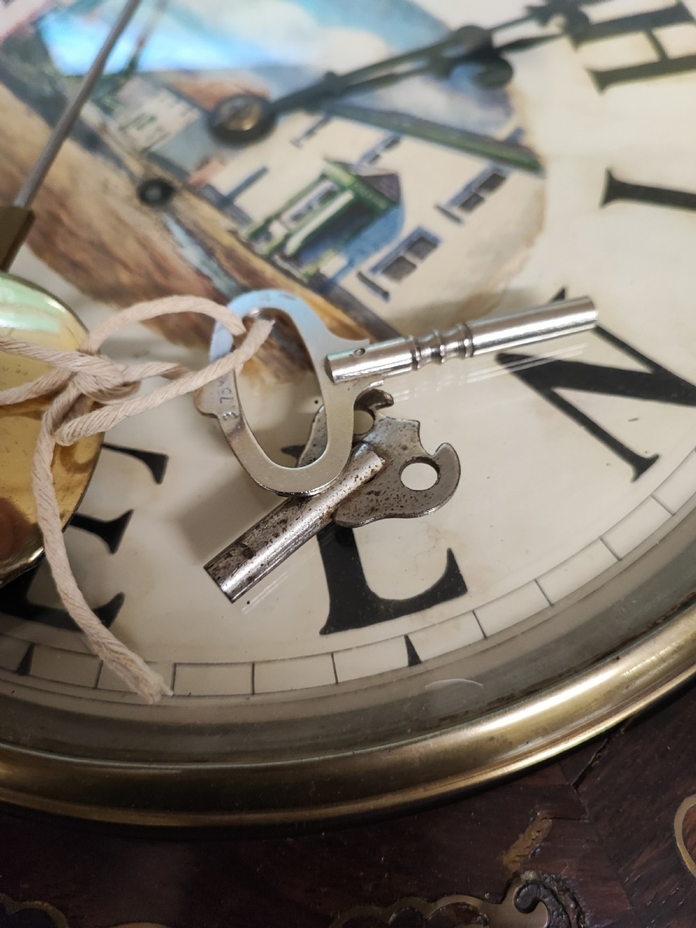 A quality mother of pearl and brass inlaid fusee drop dial wall clock. View V