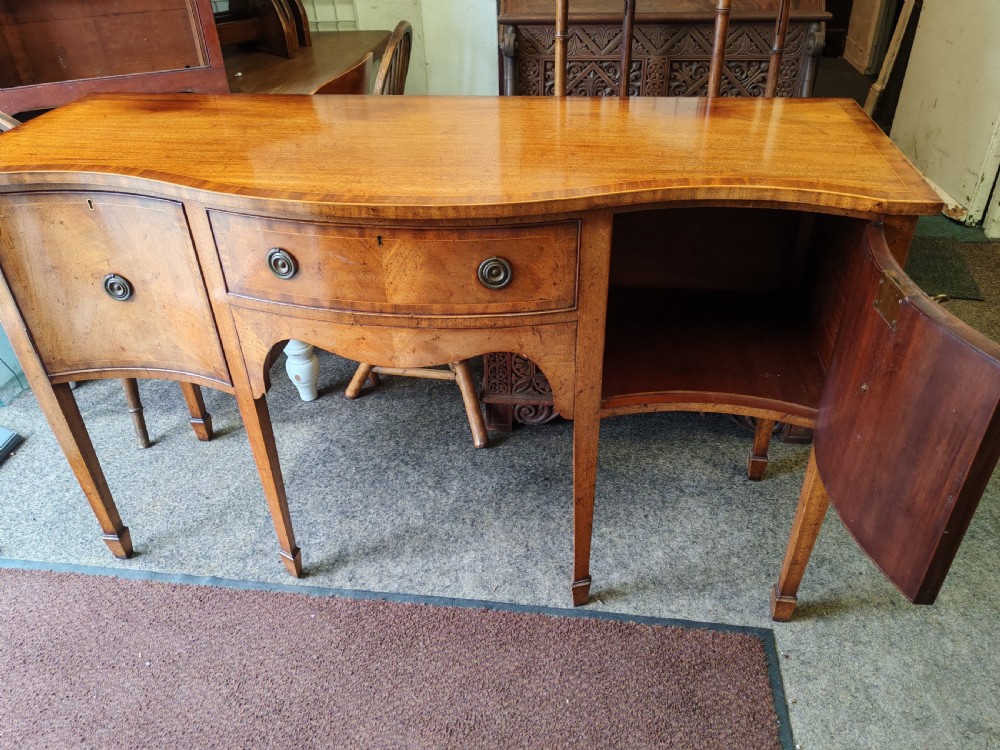 Antique mahogany, serpentine and inlaid sideboard in the George III style. View IV