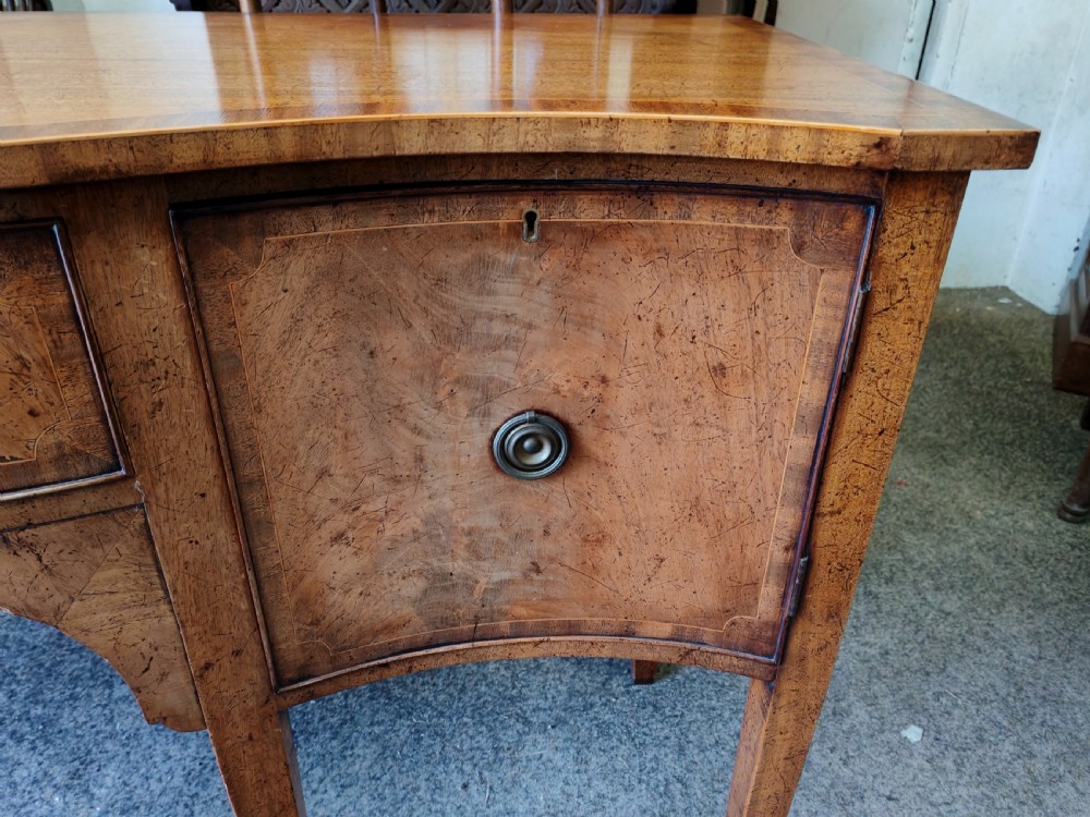 Antique mahogany, serpentine and inlaid sideboard in the George III style. View V