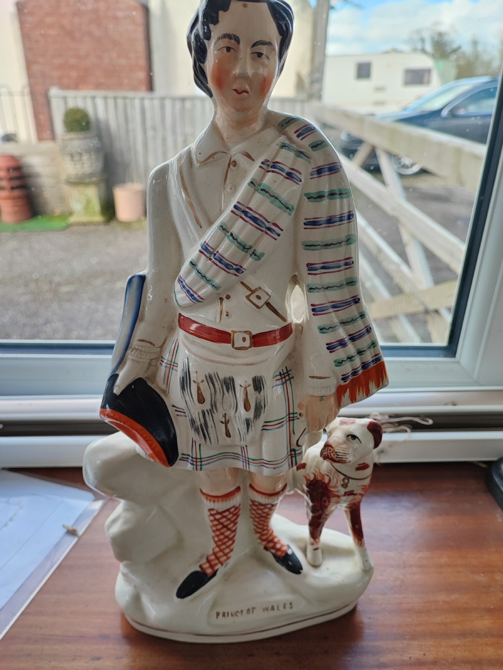 Victorian Staffordshire earthenware figure depicting the Prince of Wales in Scottish Highland attire alongside a hound. View VII