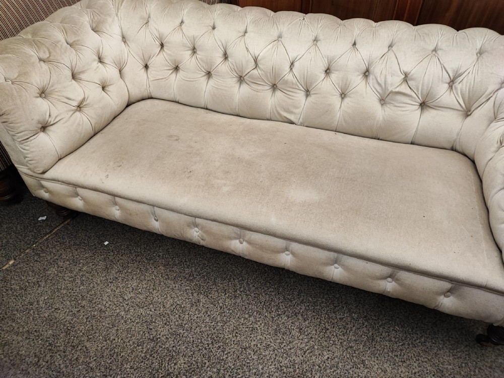 A large Victorian chesterfield sofa. View VI