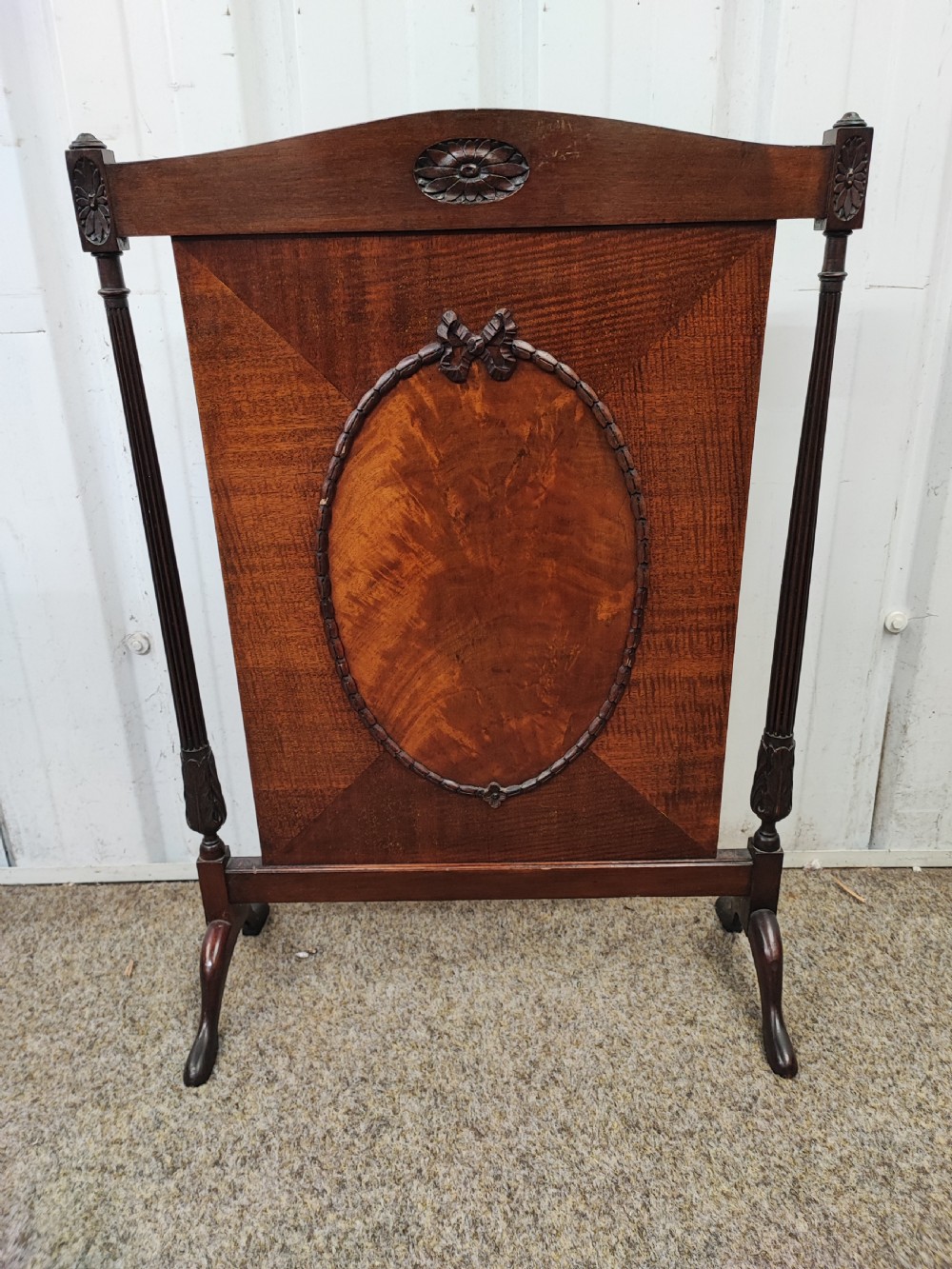 A quality Georgian style mahogany fire screen.