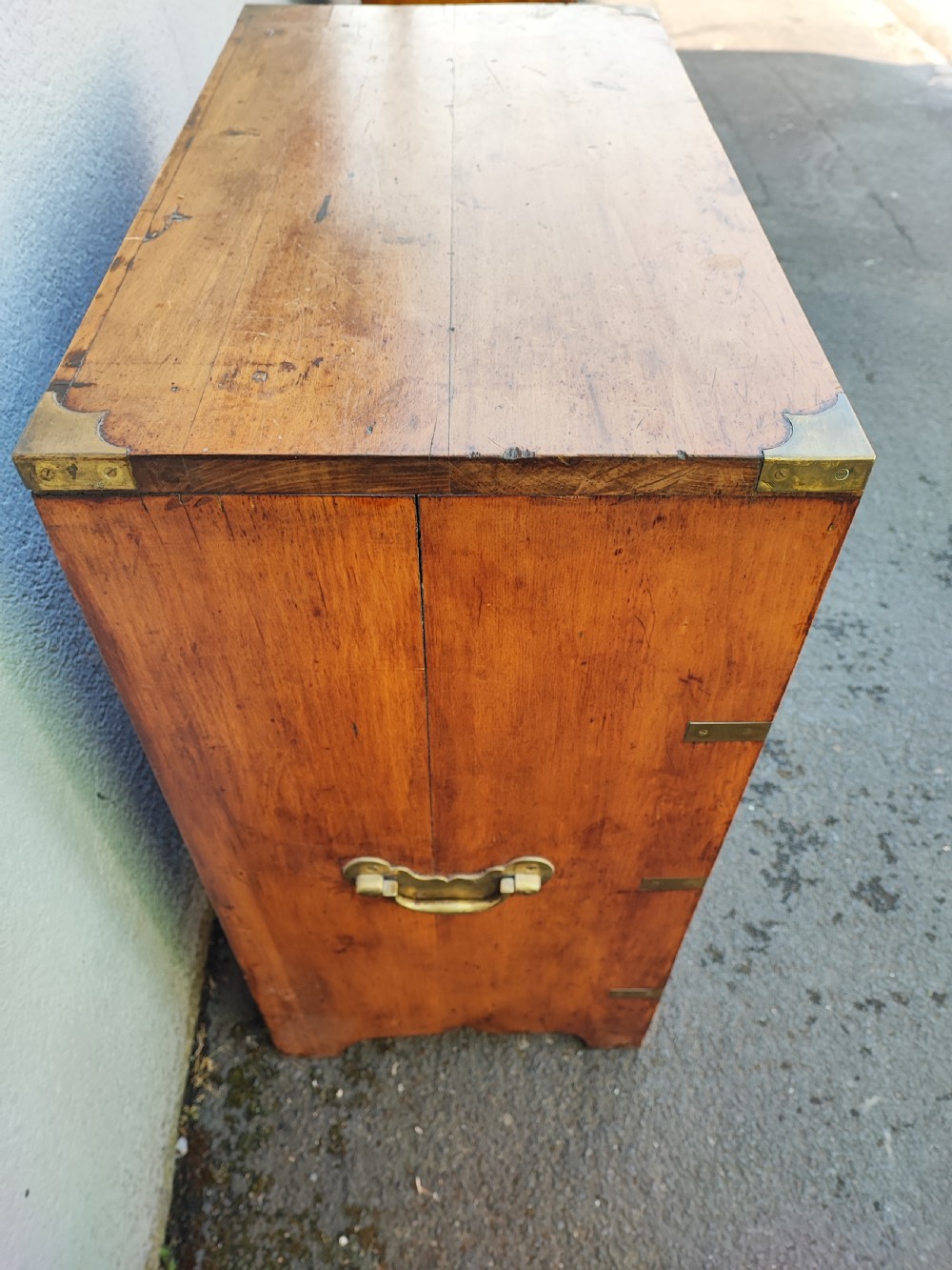 A small antique fruitwood military chest. View VII