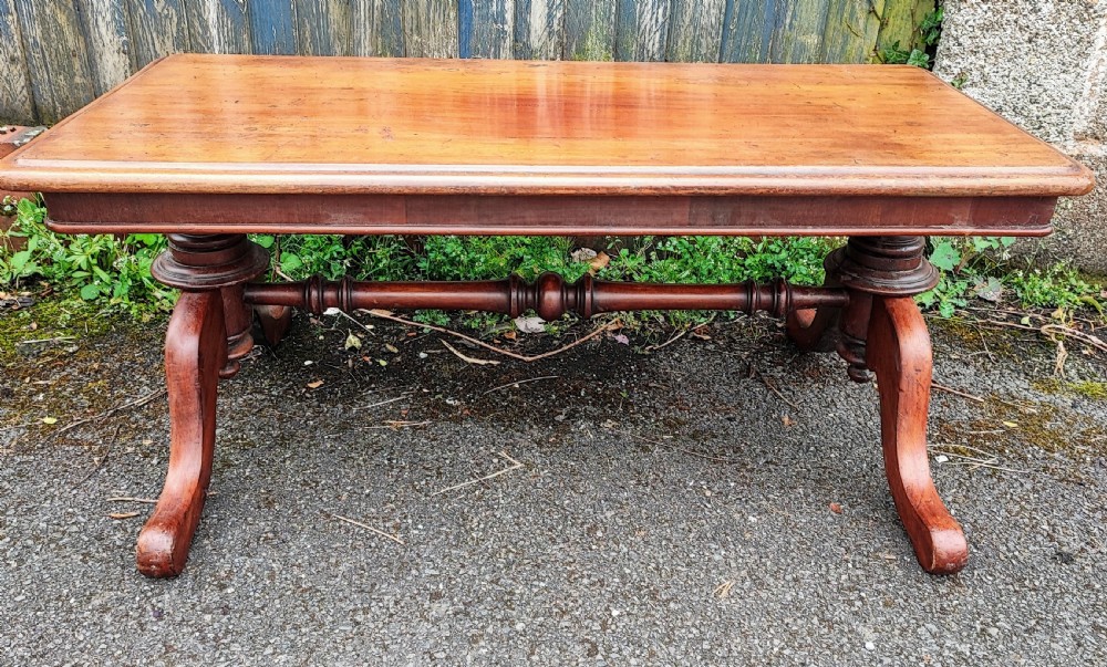 A Victorian mahogany stretcher coffee table.