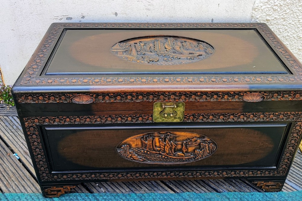 Oriental carved camphor trunk.