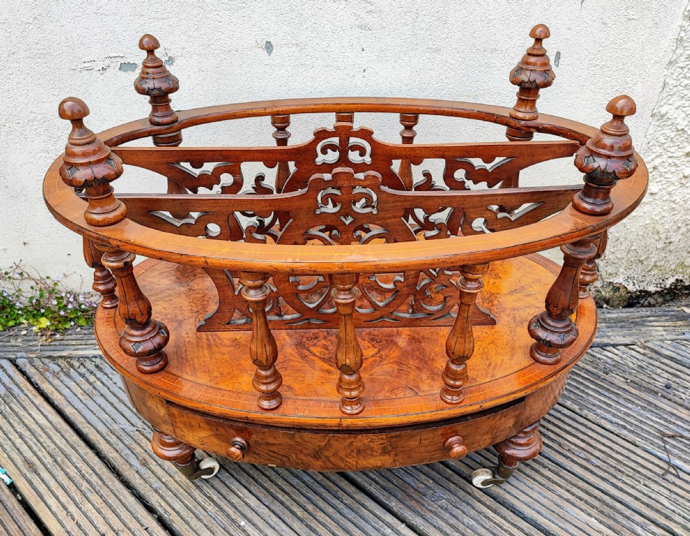 A superb oval Victorian walnut Canterbury.
