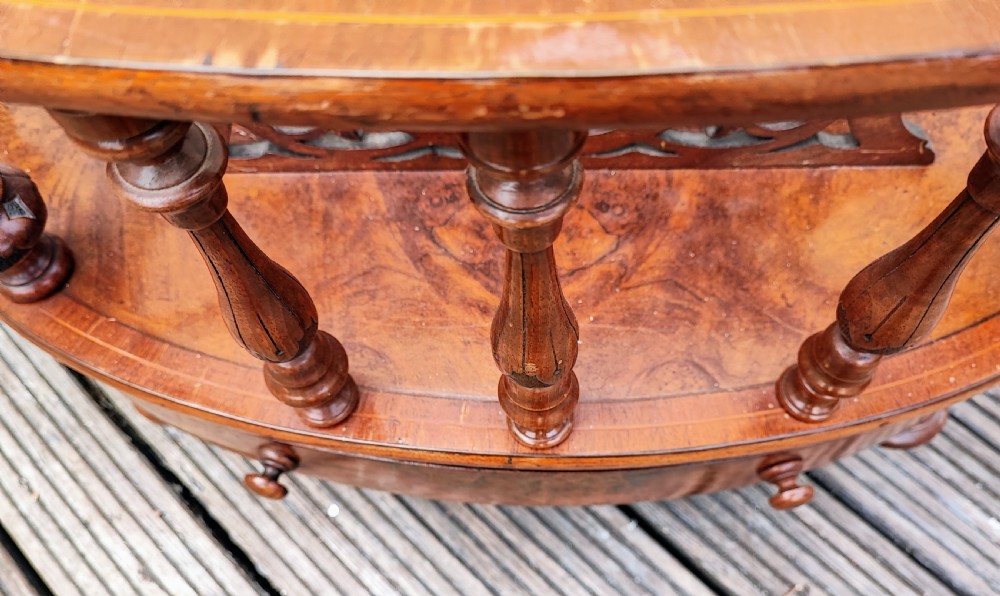 A superb oval Victorian walnut Canterbury. View III