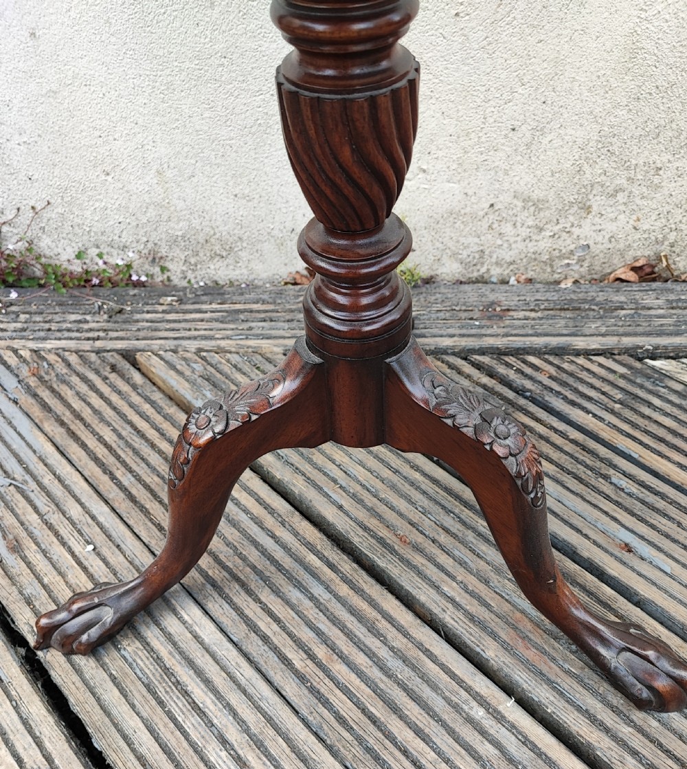 An antique George III style mahogany wine table featuring a spindle gallery rim, a turned spiral twist stem, and carved tripod cabriole legs with claw and ball feet. View VII
