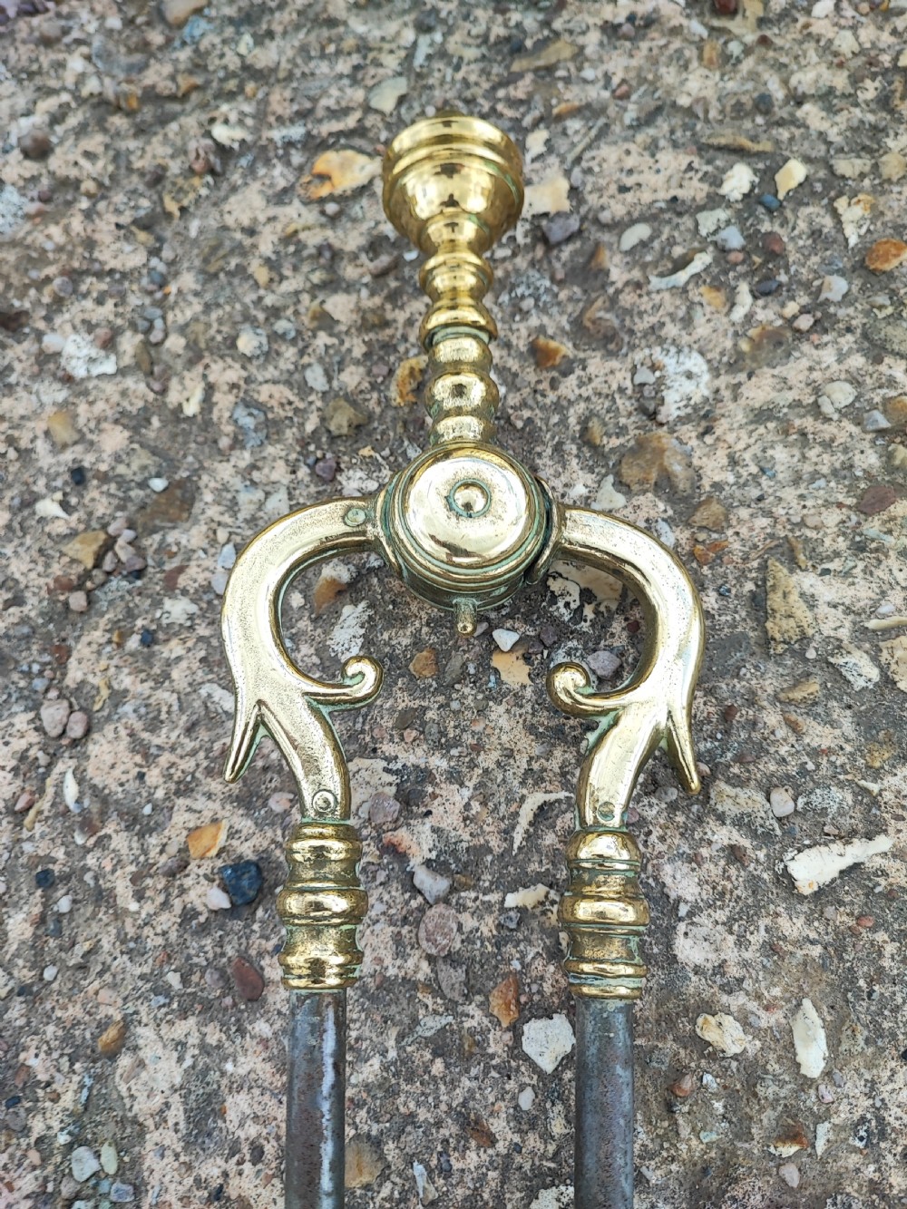 A superb antique serpentine fender and a set of 3 brass and iron fire irons. View IV