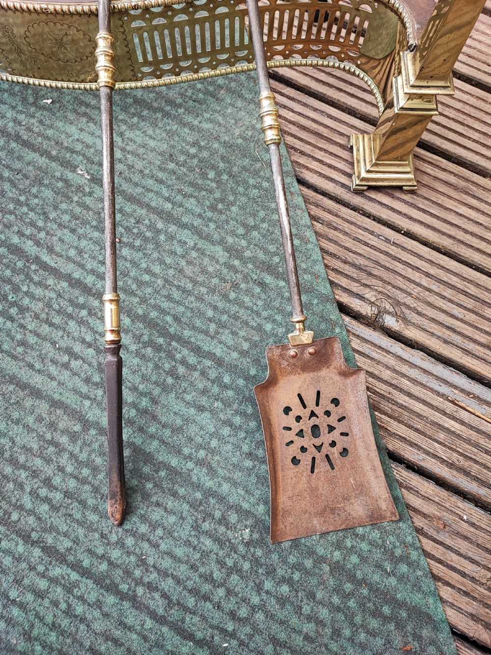 A superb antique serpentine fender and a set of 3 brass and iron fire irons. View VII
