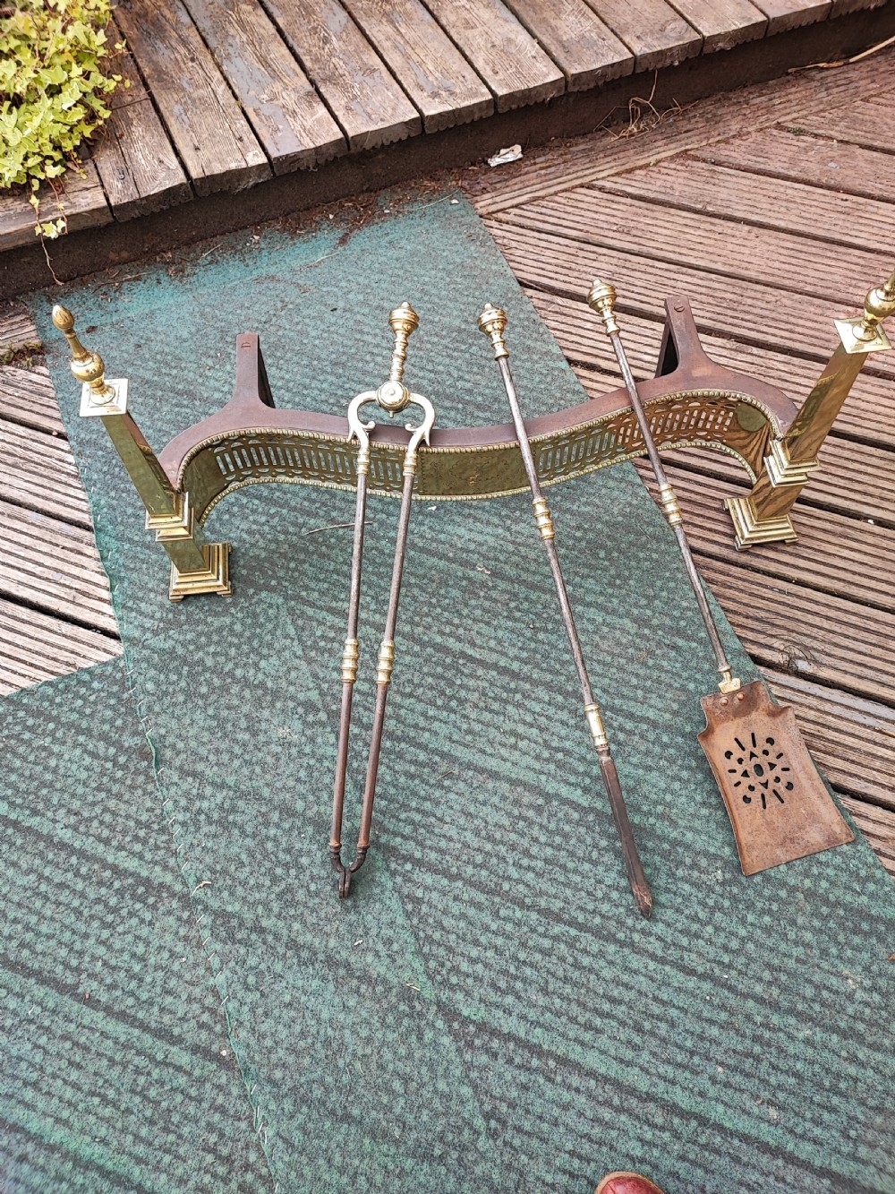 A superb antique serpentine fender and a set of 3 brass and iron fire irons. View VIII