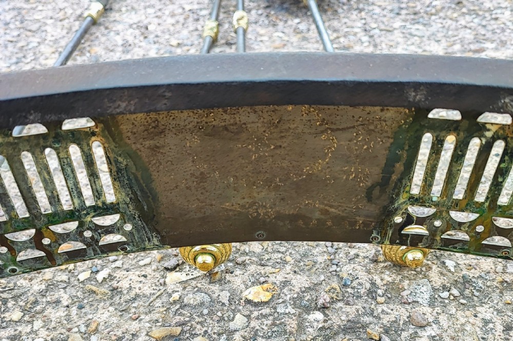 A superb antique serpentine fender and a set of 3 brass and iron fire irons. View X
