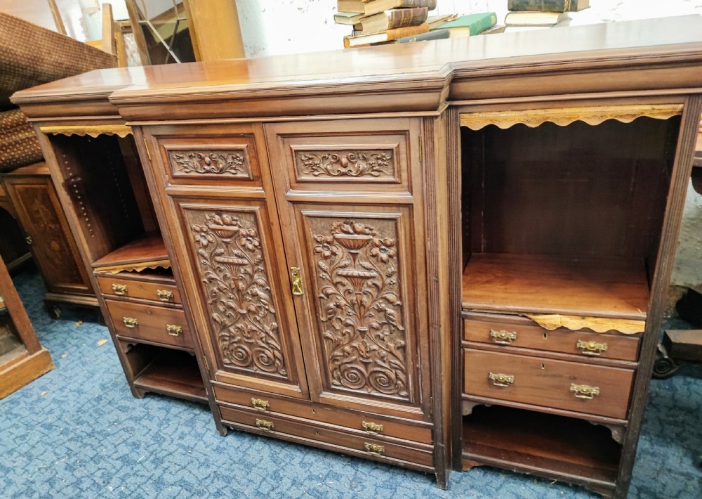 A quality antique mahogany carved open bookcase.