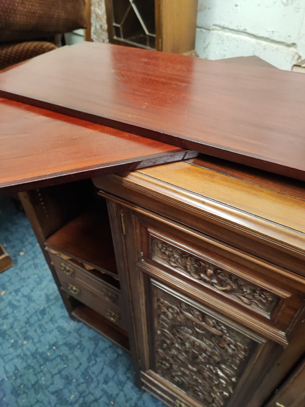 A quality antique mahogany carved open bookcase. View IV