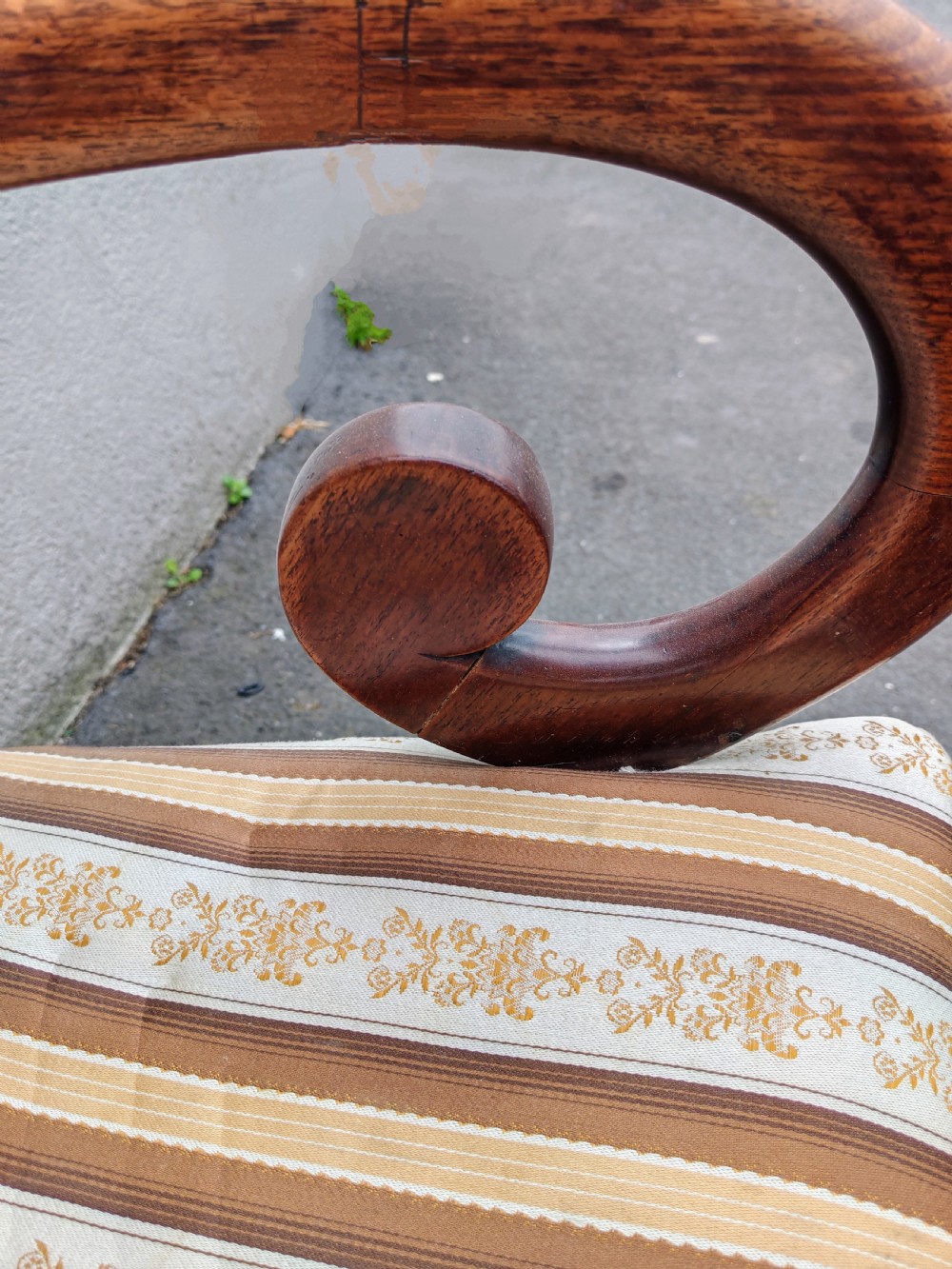 A Regency mahogany armchair with sweeping scroll armrests, a curved crest rail, turned front legs, and a striped upholstered seat. View VIII