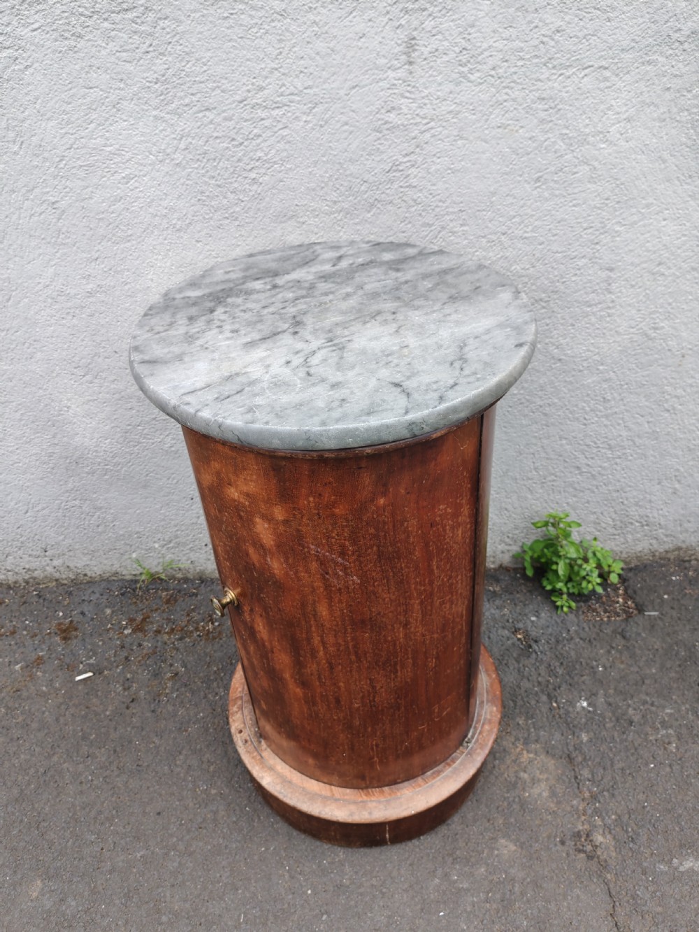 Antique mahogany circular pedestal pot cupboard.