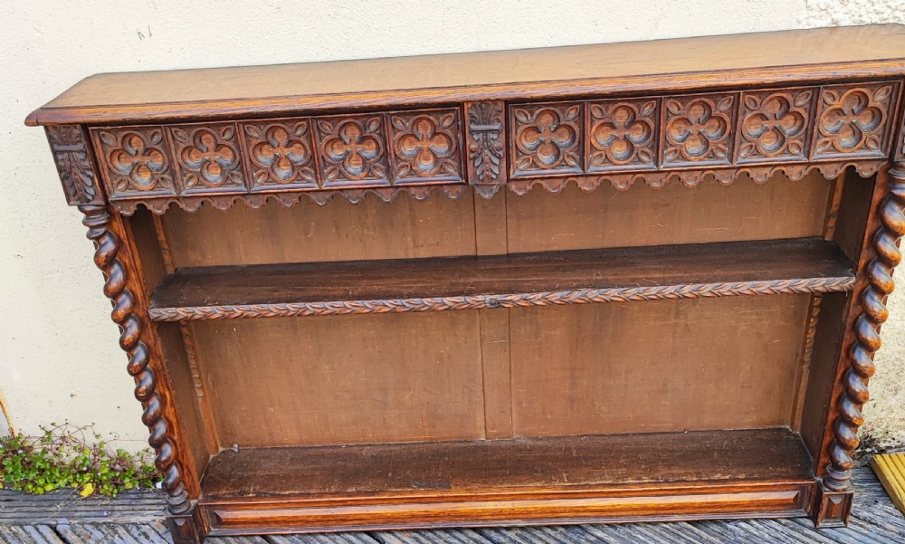 Antique gothic Oak low open bookcase.