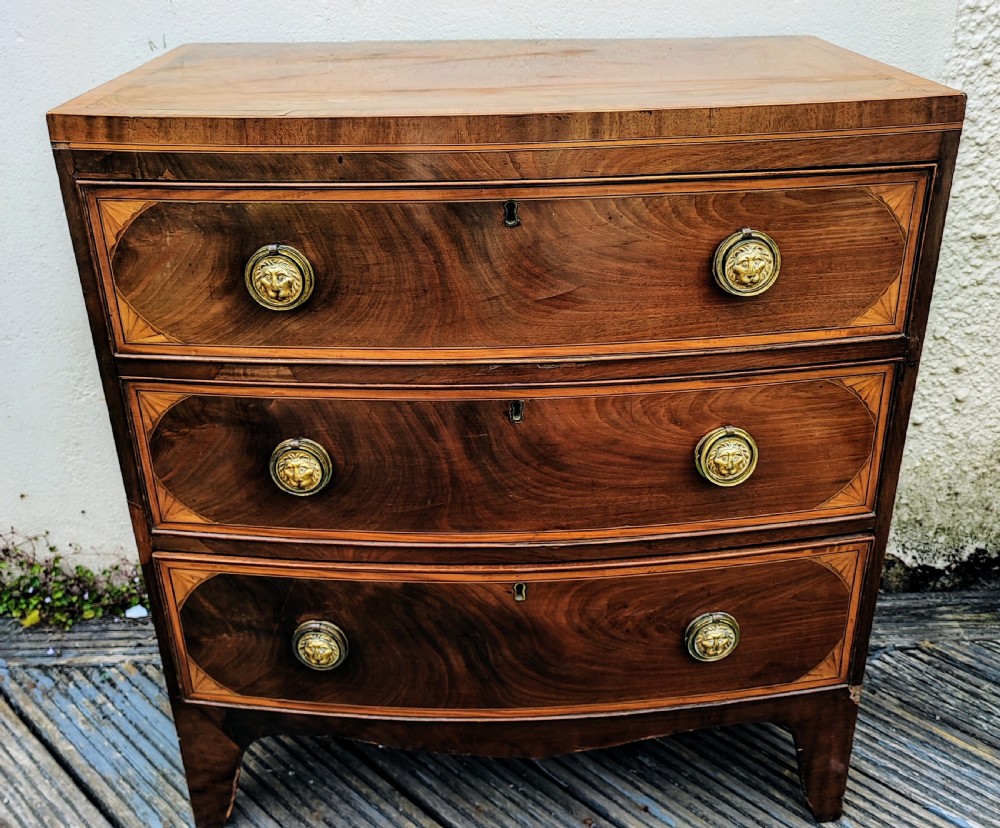Regency mahogany inlaid bow front chest of drawers. View VI