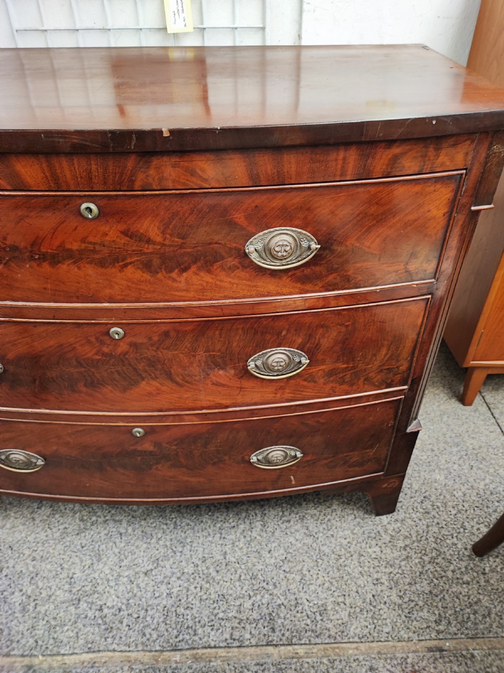 Antique mahogany bow front chest of drawers. View II