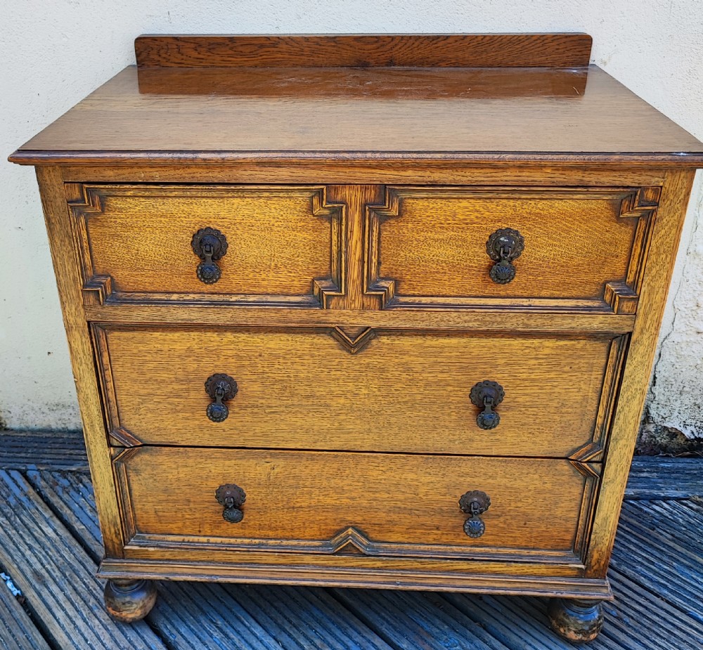 Antique solid oak Jacobean style chest of drawers.