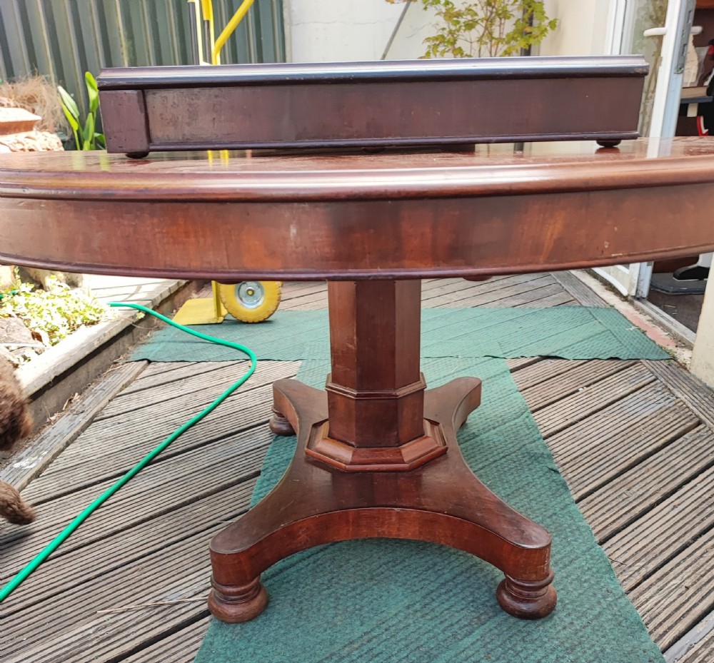 Antique mahogany circular extending dining table. View VI