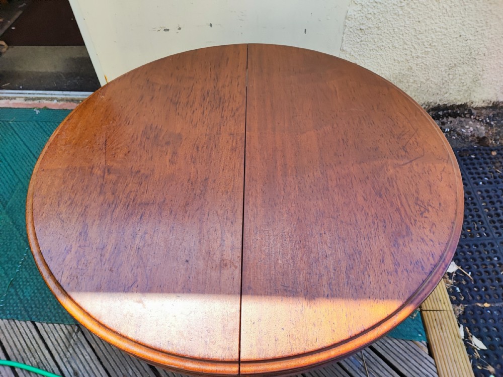 Antique mahogany circular extending dining table. View XII