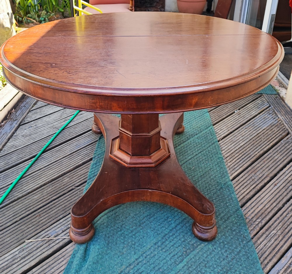 Antique mahogany circular extending dining table. View XIII