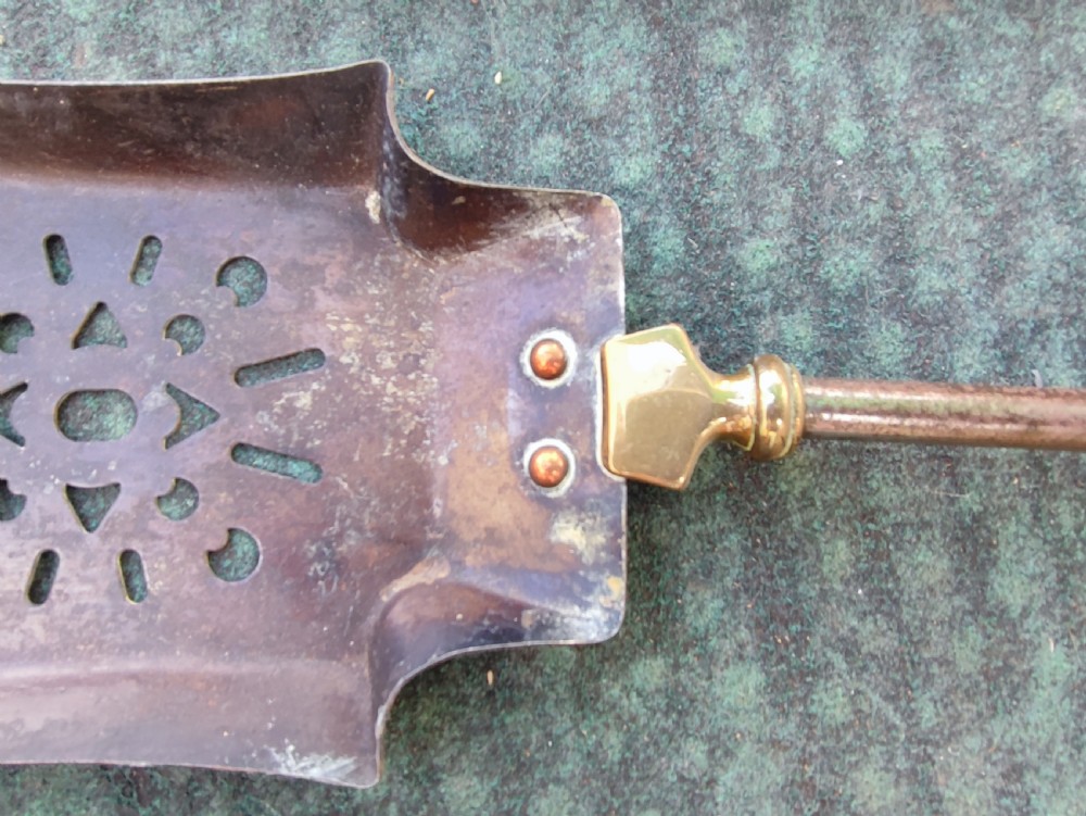 A superb set of antique brass and iron fire irons. View IV