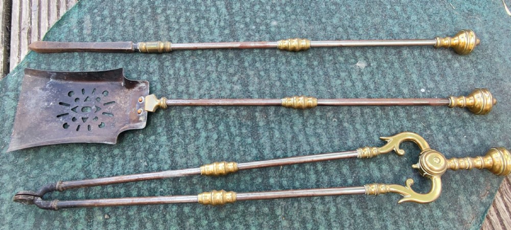 A superb set of antique brass and iron fire irons. View VIII