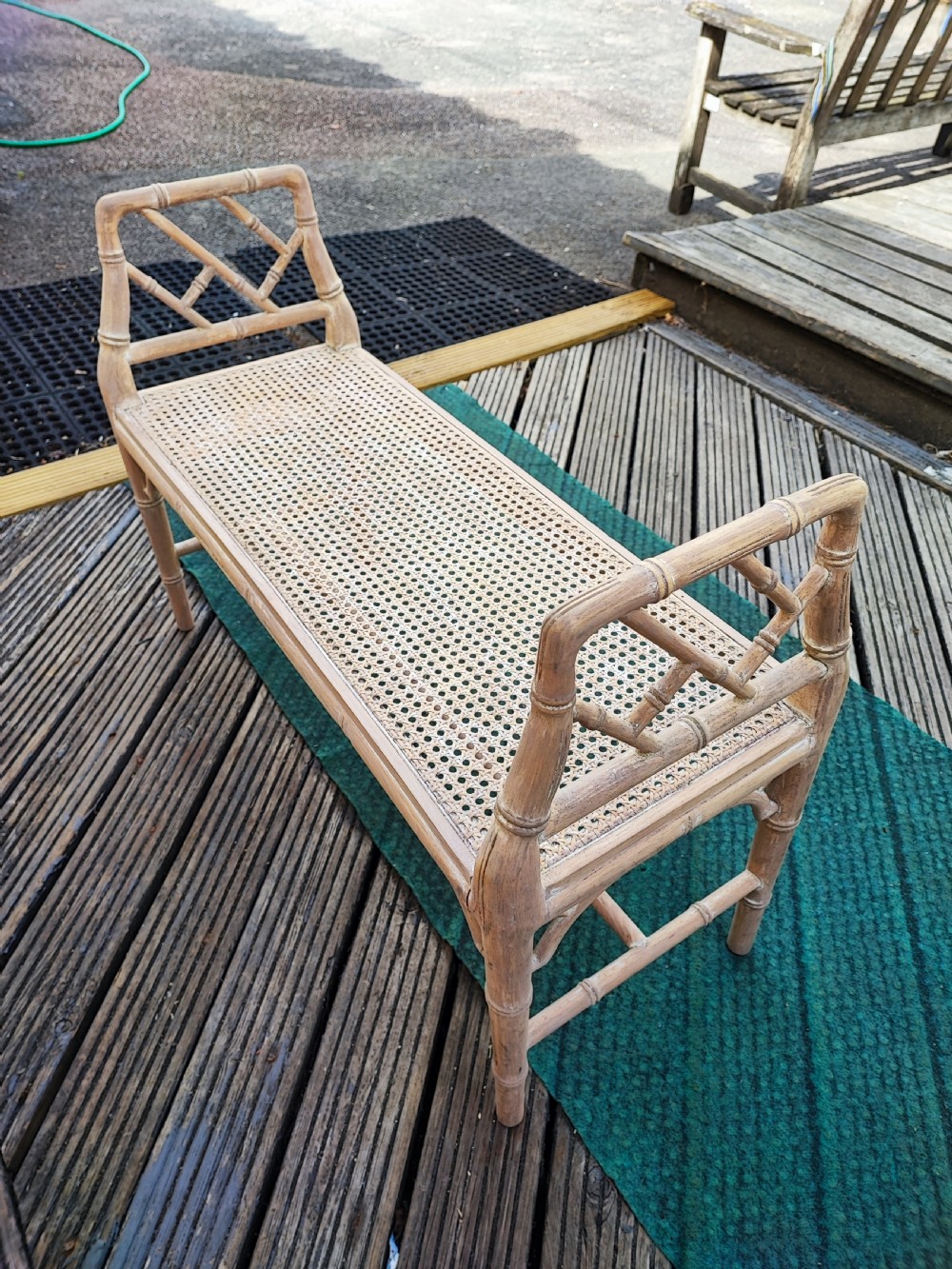 A window seat,in simulated bamboo.