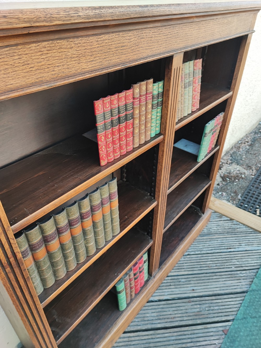 A fine Edwardian oak open bookcase. View XI