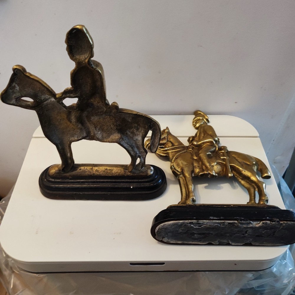 Antique pair of brass military door stops View II