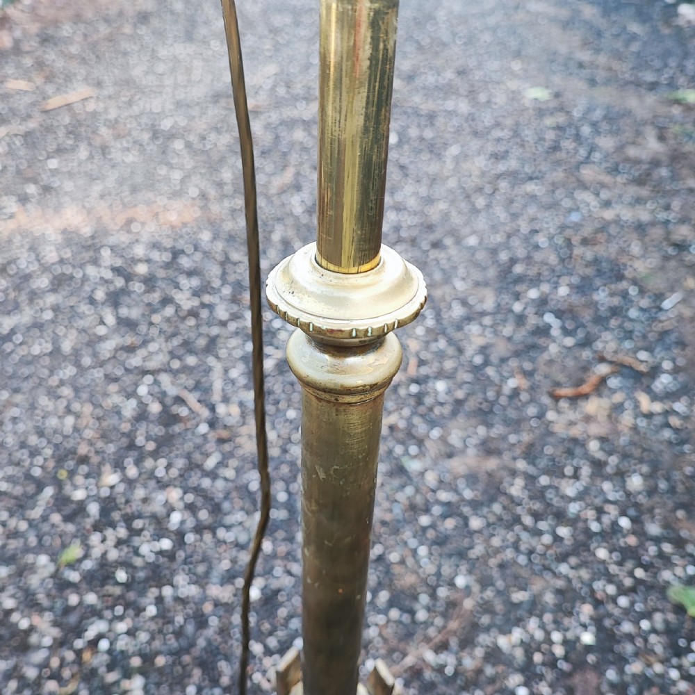 A tall Victorian brass and copper standard lamp featuring an ornate cast footed base, a central column, and a copper reservoir casing. View VI