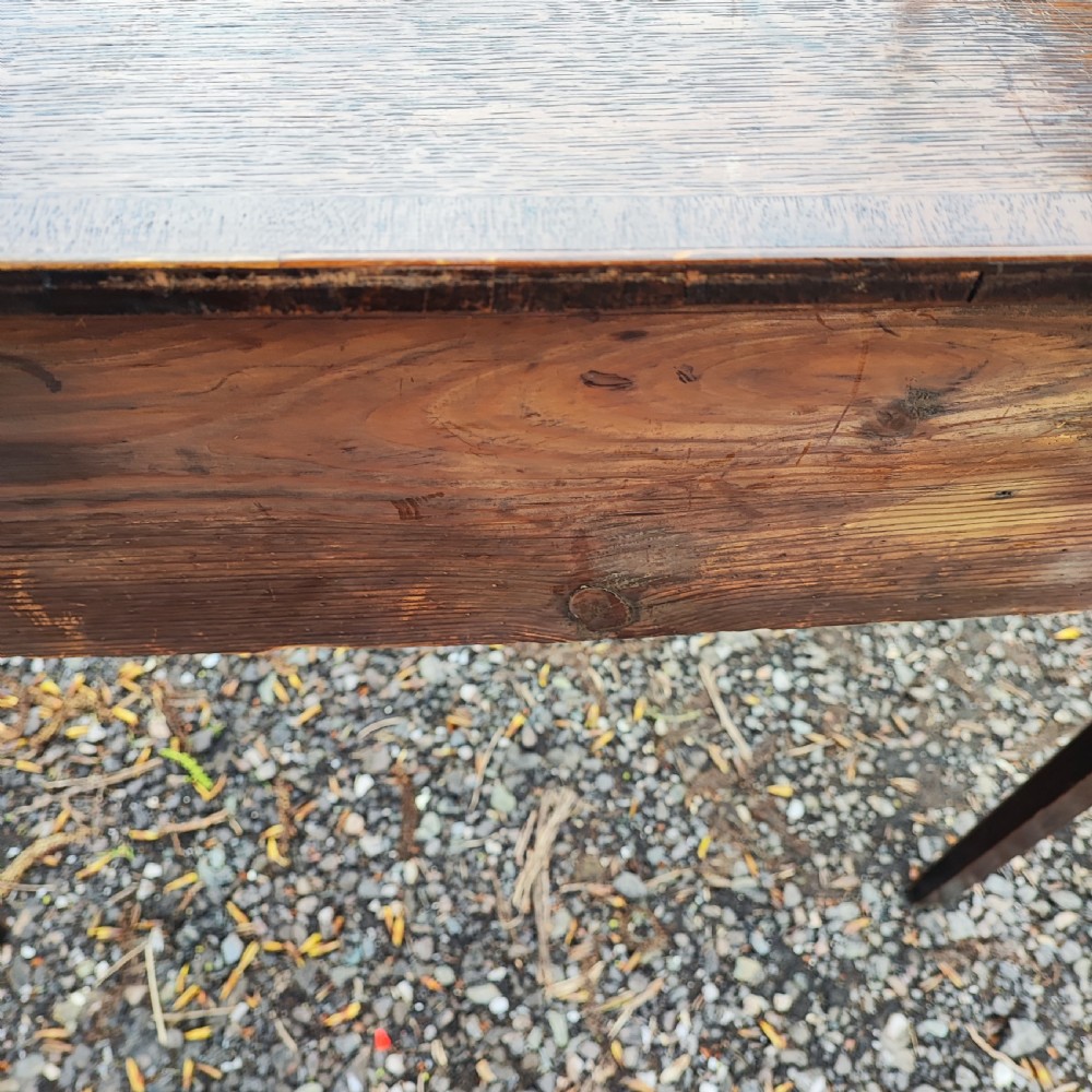 A Georgian dark oak lowboy side table featuring a rectangular top, three drawers with brass handles, inlaid stringing, corner spandrels, and straight tapering legs. View VII