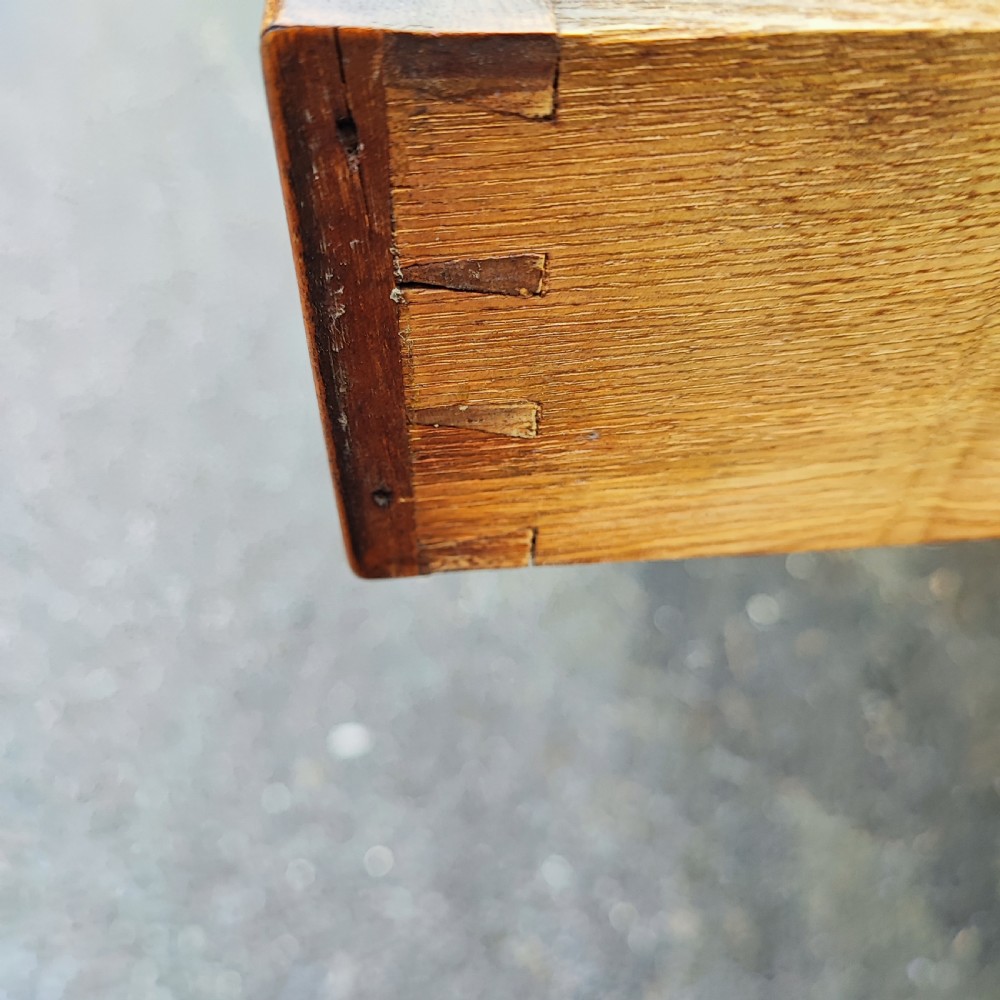 A golden satinwood side writing table featuring two frieze drawers with turned handles and four turned tapered legs. View V