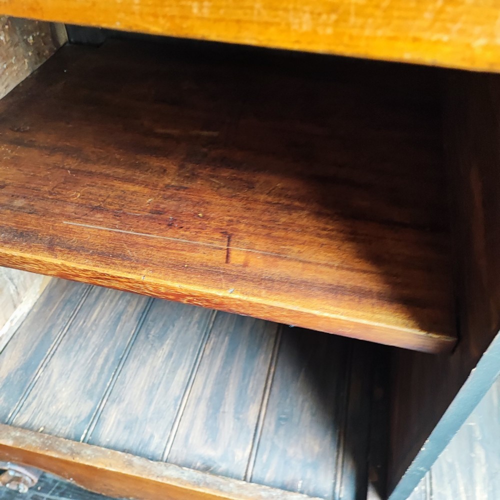 An 18th century French cherry wood side cabinet featuring two drawers above two carved panel doors with ornate metal escutcheons and cabriole feet. View VI