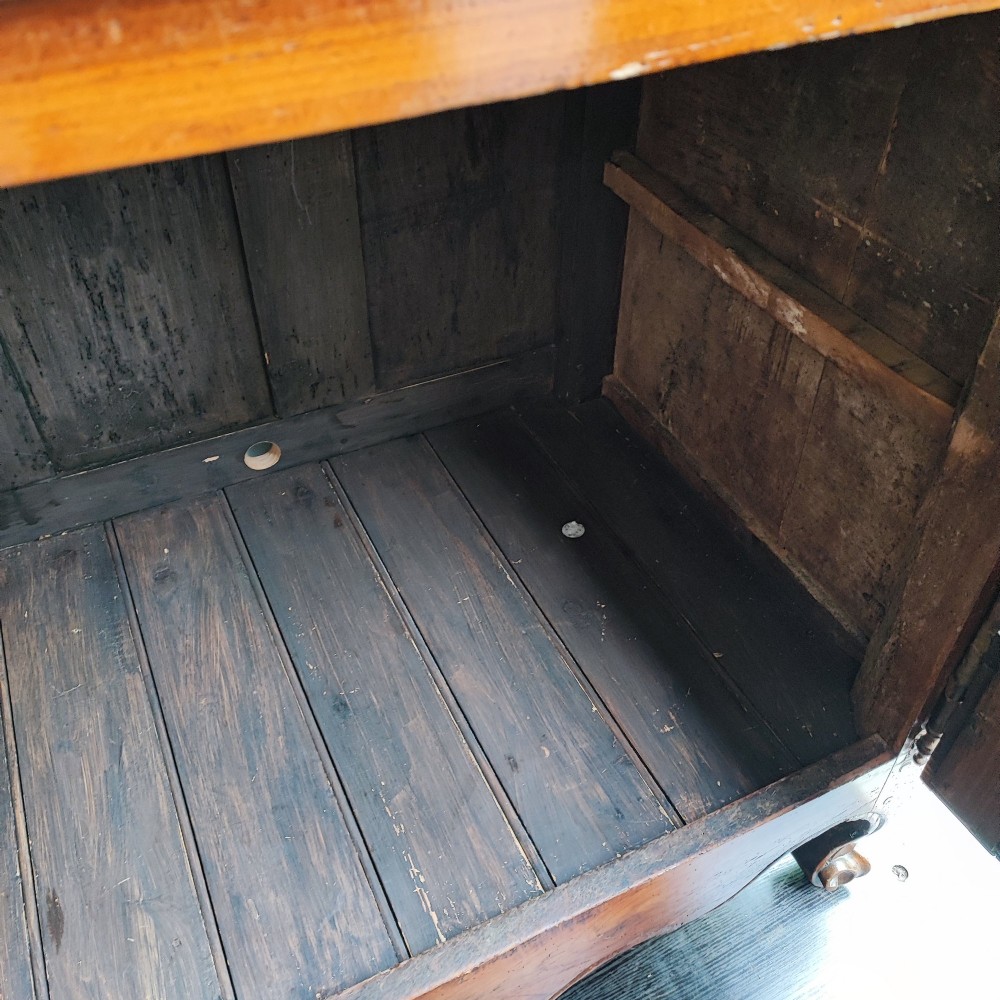An 18th century French cherry wood side cabinet featuring two drawers above two carved panel doors with ornate metal escutcheons and cabriole feet. View VII