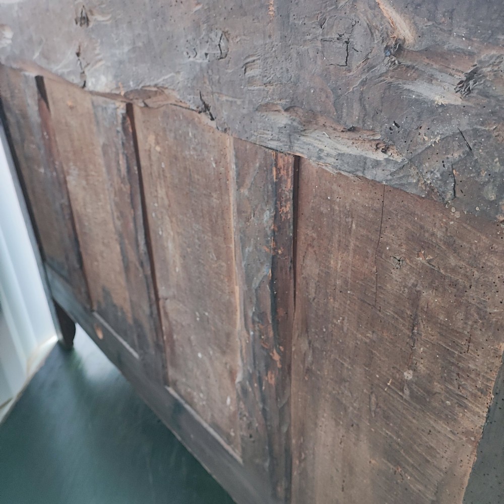 An 18th century French cherry wood side cabinet featuring two drawers above two carved panel doors with ornate metal escutcheons and cabriole feet. View VIII