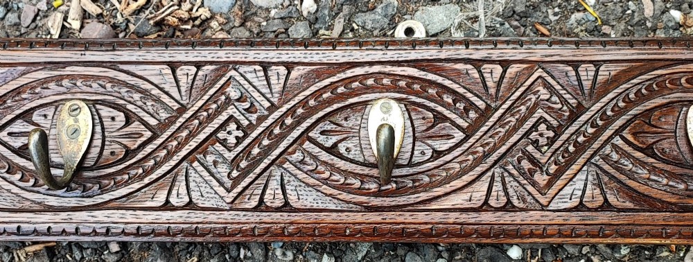 Antique long carved oak coat rack View II