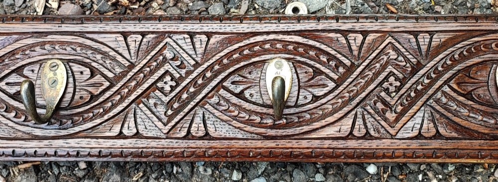 Antique long carved oak coat rack View III