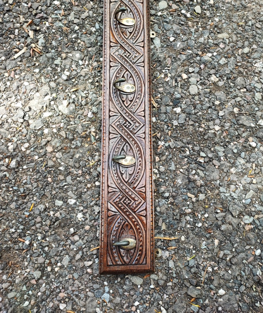 Antique long carved oak coat rack View IV