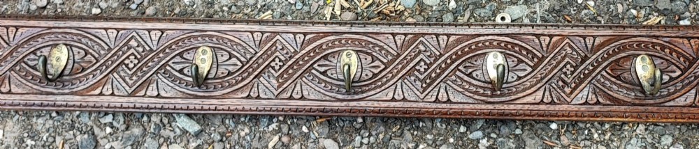 Antique long carved oak coat rack View V