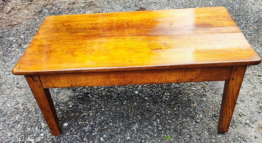 An antique French cherrywood rectangular coffee table with a warm golden-amber surface and square straight legs. View III