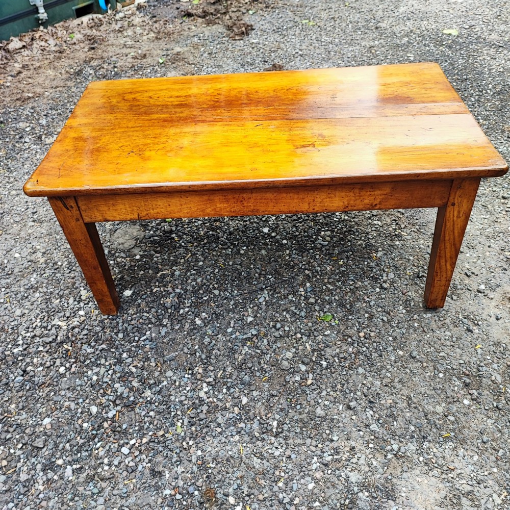 An antique French cherrywood rectangular coffee table with a warm golden-amber surface and square straight legs. View IV