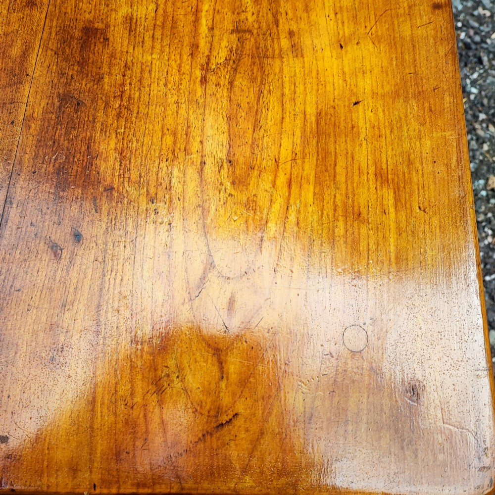 An antique French cherrywood rectangular coffee table with a warm golden-amber surface and square straight legs. View VII