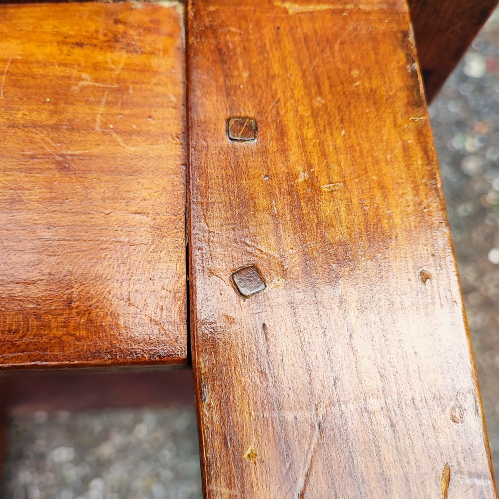 An antique French cherrywood rectangular coffee table with a warm golden-amber surface and square straight legs. View X