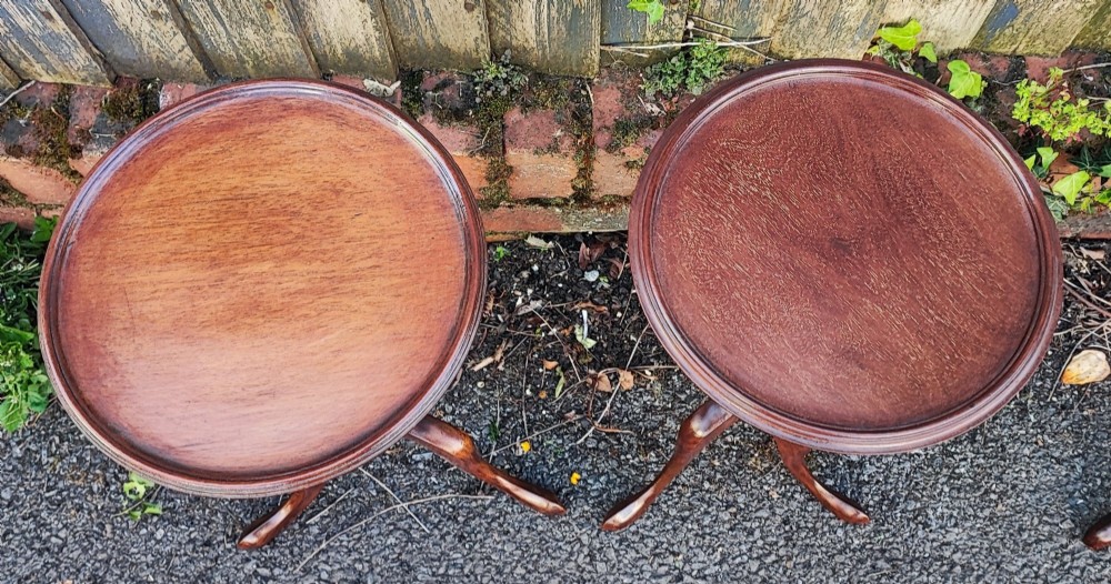A matched pair of mahogany wine tables with circular dished tops, reeded turned stems, and cabriole tripod legs. View V