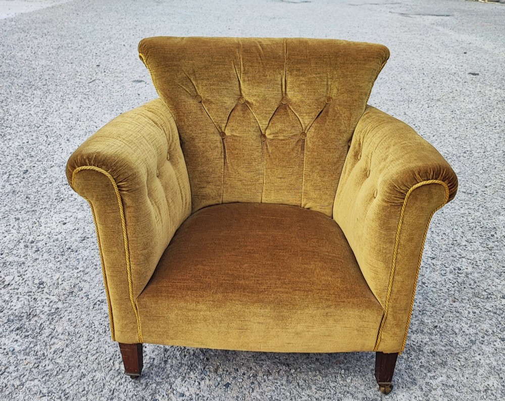Victorian mahogany upholstered arm chair in the style of Howard's