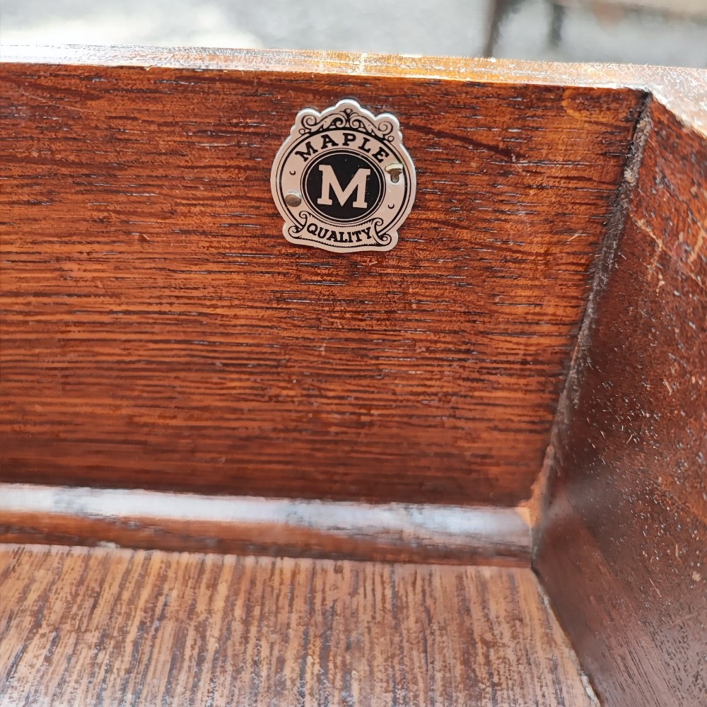 An antique burr walnut writing table featuring five drawers, brass handles, and carved cabriole legs. View III